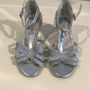 Girl’s silver heels